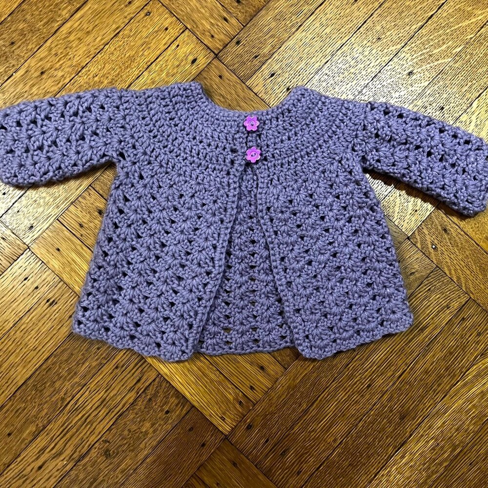 Adorable hand-made purple sweater.
